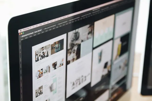 A modern computer screen displaying web design work, showcasing creative visuals in a workspace. Web design agency services and packages guide for 2027